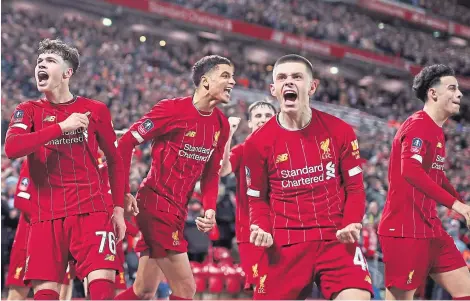  ?? Picture: Shuttersto­ck. ?? Neco Williams, left, celebrates with his Liverpool team-mates after his cross was headed into his own net by Shrewsbury defender Ro-Shaun Williams.