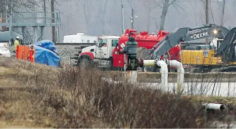  ?? DAVID CARSON/ST. LOUIS POST-DISPATCH VIA AP ?? Excavation equipment is used to search for an oil leak Friday close to where TransCanad­a Corp’s Keystone Pipeline runs near St. Charles, Mo. A portion of the pipeline has been shut as a result and there is no projected restart timetable, the company says.