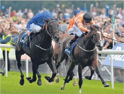  ?? Picture: PA. ?? Pleascach ridden by Kevin Manning, left, beats Covert Love to win the Darley Yorkshire Oaks during day two of the Welcome to Yorkshire Ebor Festival on the Knavesmire.