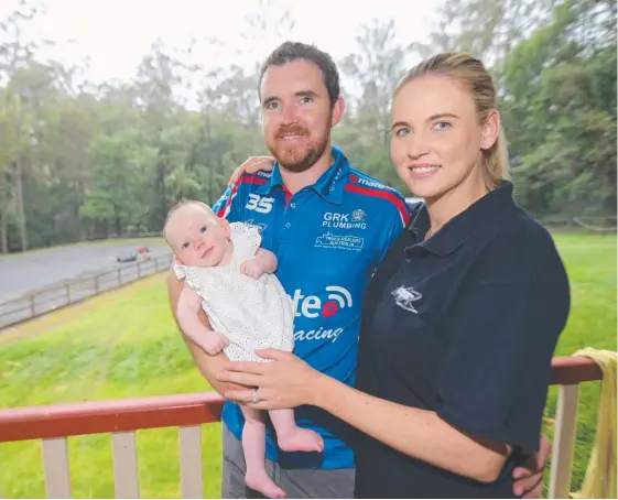  ?? Picture: MIKE BATTERHAM ?? Matt Stone, son of Supercars hall of famer Jim, with his wife Nina and new daughter Madeleine at their Guanaba home.