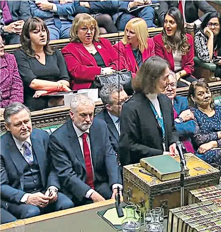  ??  ?? Theresa May affords a rare smile in the Commons, above left, as Mr Corbyn looks crestfalle­n at the result of the confidence vote