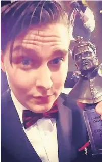  ??  ?? ●●Theatre producer Brian Hook with his Olivier award for his work on a play called Rotterdam