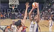 ?? Barry Gossage NBAE/Getty Images ?? JASMINE WALKER takes a shot against the Mercury in the Sparks’ first game without Liz Cambage.