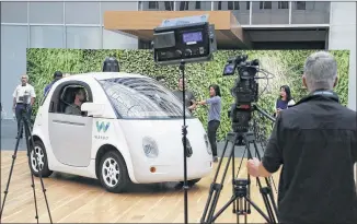  ?? ERIC RISBERG / ASSOCIATED PRESS 2016 ?? This Waymo driverless car was on display in December at a Google event in San Francisco. California regulators Wednesday published rules that would govern the use of the technology in the state, and will have a final framework next year.