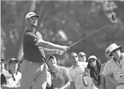  ?? JOHN DAVID MERCER/USA TODAY SPORTS ?? Jon Rahm hits his tee shot on the seventh hole during the first round of the PGA Championsh­ip golf tournament at Bellerive Country Club.