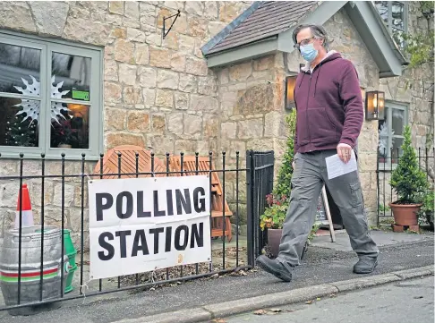  ?? ?? BY-ELECTION: A man leaves a polling station in the Docks public house on the outskirts of Oswestry yesterday.