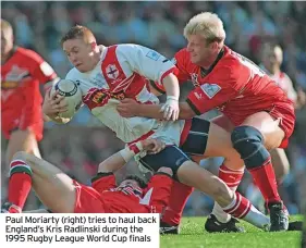  ?? ?? Paul Moriarty (right) tries to haul back England’s Kris Radlinski during the 1995 Rugby League World Cup finals