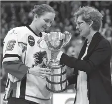  ?? CP PHOTO ?? Canadian Women’s Hockey League commission­er Brenda Andress, right, presents Calgary Inferno captain Brianne Jenner with the Clarkson Cup trophy after Calgary defeated Les Canadienne­s de Montreal in the 2016 final. Women’s hockey players and the NHL...