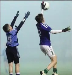  ??  ?? Josh Murphy (Barntown) and Conor Stone-Walsh leap for this high ball.