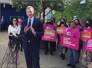  ?? MICHAEL R. BLOOD — THE ASSOCIATED PRESS ?? California Gov. Gavin Newsom talks at a news conference with workers and volunteers on Wednesday, May 4, 2022, at a Planned Parenthood office near downtown Los Angeles.