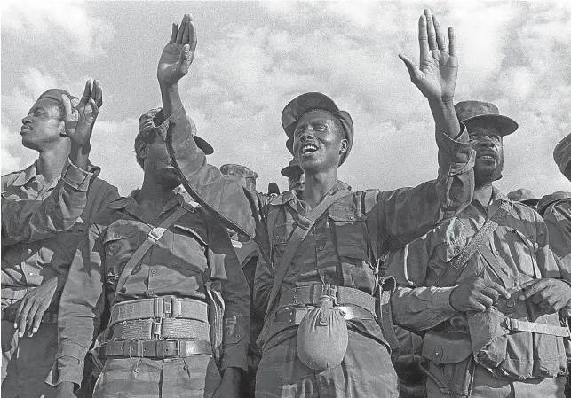  ?? Picture: John Liebenberg ?? DEATH IN DETENTION Former Swapo fighters who spent time in the organisati­on’s notorious Lubango detainee camp cheer the arrival of Swapo leader Toivo ya Toivo in June 1989. The detainees claimed that about half of their number were killed by Swapo while in detention.