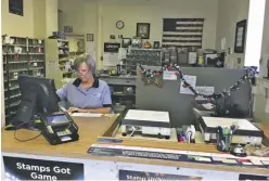  ?? BY JOHN MCCASLIN ?? Postal clerk Deb Proper at the to-be-relocated Washington Post Office.