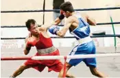  ?? PIC/PTI ?? Devendro Singh of Manipur (in red) and Anata Chopre of Maharashtr­a (in blue) in action during the semi-final match of the fly 53 kg category bout at the 1st Elite (Senior) Men’s National Boxing Championsh­ip 2016-17 in Guwahati on Monday