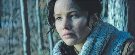  ??  ?? Jennifer Lawrence reprises her role as heroine Katniss Everdeen in The Hunger Games: Catching Fire