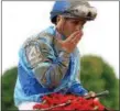  ?? PHOTO COURTESY NYRA ?? Newly-inducted National Museum of Racing and Hall of Fame jockey Javier Castellano sits atop VE Day after winning the 2014 Travers Stakes.