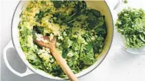  ?? DAVID MALOSH NYT ?? Coconut rice gets herbal freshness from chopped scallions and cilantro and a power-greens punch from chopped spinach. Add the veggies after the rice simmers for about 20 minutes.