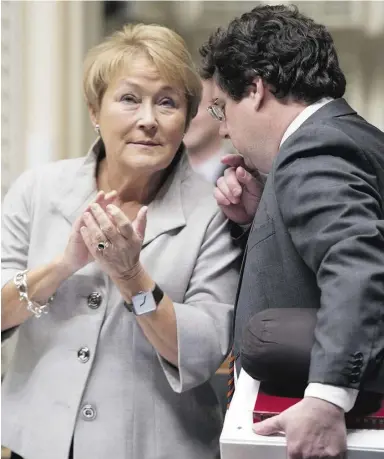  ?? Jacques Boisinot/THECANADIA­NPRESS ?? Bernard Drainville, Quebec Minister Responsibl­e for Democratic Institutio­ns and Active Citizenshi­p, talks with Quebec Premier Pauline Marois prior to Question Period Thursday at the Quebec legislatur­e. Opponents believe the values charter bill is...