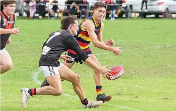  ?? ?? Nilma Darnum’s Kade Rossboroug­h and Longwarry’s Harrison Mills compete for possession.