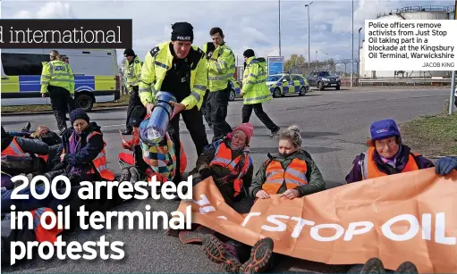  ?? JACOB KING ?? Police officers remove activists from Just Stop Oil taking part in a blockade at the Kingsbury Oil Terminal, Warwickshi­re