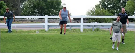  ?? Donnis Hueftle-Bullock ?? The Rotary Club of Broken Bow held their first ever Golf Scramble June 26. From Left Alex Eller, Kaci Johnson, Gavin Higgins, and Brent Apperson walk to the next hole. The two groups competed alongside each other throughout the event.