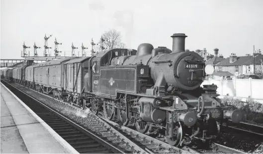  ?? Peter D T Pescod/Transport Treasury ?? Rattling over the junction pointwork at St Denys, Ivatt ‘2MT’ 2-6-2T No 41319 heads an afternoon van train to either Southampto­n Terminus or the Old Docks on Thursday, 13 May 1966. Such duties had occupied this locomotive for several years, most likely since it reached Eastleigh from Tunbridge Wells West shed back in the summer of 1959.