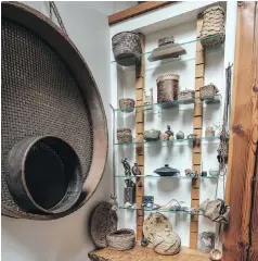  ??  ?? Clockwise from above: • The large wall basket is a Japanese seed sifter, with small sifter inside. Shelves hold baskets, pots and treasures from around the world.