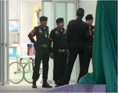  ??  ?? Security guards gather at the Chiang Rai Prachanukr­oh hospital, where four of 12 Thai schoolboys who were rescued from the flooded cave are being treated, in the northern province of Chiang Rai.