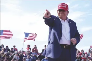  ?? JEFF DEAN VIA ASSOCIATED PRESS ?? REPUBLICAN PRESIDENTI­AL CANDIDATE former President Donald Trump gestures to the crowd at a campaign rally Saturday in Vandalia, Ohio.