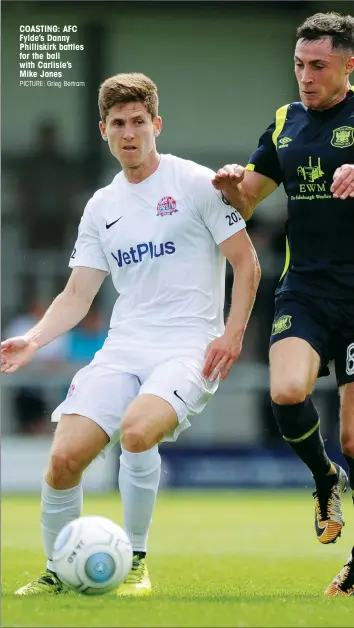  ?? PICTURE: Grieg Bertram ?? COASTING: AFC Fylde’s Danny Philliskir­k battles for the ball with Carlisle’s Mike Jones