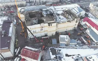  ?? Russian Ministry for Emergency Situations ?? Emergency services crews clear wreckage after a fire destroyed the Winter Cherry mall in Kemerovo, Russia, killing more than 60 people including at least eight children.