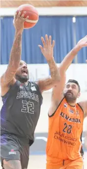  ?? PHOTOGRAPH COURTESY OF STRONG GROUP ?? RENALDO Balkman (left) and Strong Group coast to their third straight win following an 87-61 triumph over Al Wahda of Syria in the 32nd Dubai Internatio­nal Basketball Championsh­ip.