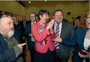  ??  ?? Democratic Unionist Party leader and former first minister Arlene Foster celebrates after being re-elected in Omagh.