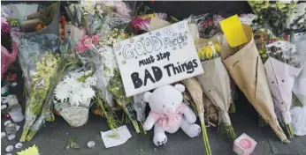  ?? — AFP ?? Tributes to the victims and the missing from the Grenfell Tower block fire disaster are seen close to the scene in west London, on Sunday.