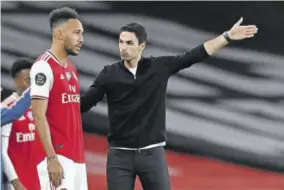  ?? (photos: afp) ?? Arsenal’s Spanish Head Coach Mikel Arteta (right) talks with Arsenal’s Gabonese striker Pierre-emerick Aubameyang before bringing him on as a substitute during the English Premier League football match between Arsenal and Liverpool at Emirates Stadium in London in this July 15, 2020 file photo. Mikel Arteta believes Liverpool are getting “better and better” but says Arsenal must go to Anfield believing they can win after two-straight victories against Jurgen Klopp’s men.