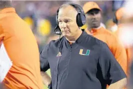  ?? RYAN M. KELLY/GETTY ?? Mark Richt, awaiting a decision after officials reviewed a play in the second half of Miami’s loss at Virginia, said his team will use its open date to evaluate scheme and personnel.