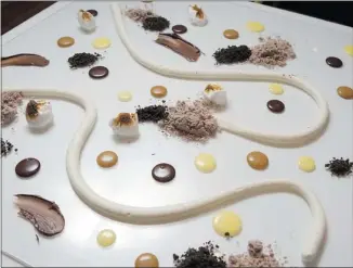  ?? PHOTOS: ALLEN MCINNIS/ THE GAZETTE ?? The dessert is spooned, smeared and swirled on to plastic boards set on the table. It makes for a messy, yet delicious, presentati­on of textures and flavours.