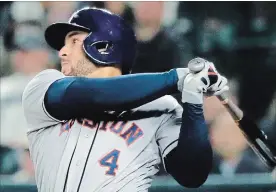  ?? TED S. WARREN THE ASSOCIATED PRESS ?? Astros’ George Springer is using the Axe Bat. The handle is shaped like the handle of an axe.