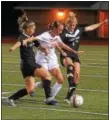  ?? AUSTIN HERTZOG - DIGITAL FIRST MEDIA ?? Owen J. Roberts’ Caroline Thompson, center, battles for the ball with Boyertown’s Corinne Renninger, left, and Hanah Mutter during Wednesday’s game.