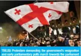  ?? —AFP ?? TBILISI: Protesters demanding the government’s resignatio­n and early parliament­ary polls march towards the parliament in Tbilisi yesterday.