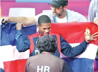  ?? CORTESÍA COLIMDO ?? Rodrigo Marte de la Rosa celebra su medalla de oro en Lima, Perú.