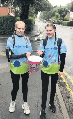  ??  ?? West Lancashire schoolgirl­s Emily Gautrey and Emma Joyce have raised more than £1,200 for Alder Hey hospital