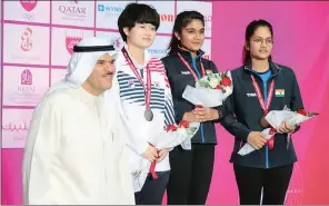  ??  ?? India’s Esha Singh (2nd right), Priya Raghav (right), and Korea’s Hyo Jeong with an official during the medals presentati­on ceremony of 14th Asian Shooting Championsh­ip at the ‘Final Hall’ at Losail Shooting Complex on Thursday.