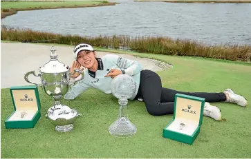  ?? GETTY IMAGES ?? Lydia Ko with the spoils of success after a winning weekend on the LPGA Tour .