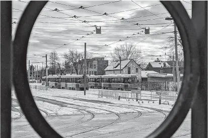  ??  ?? Streetcars sit at a station in Toronto, Canada, on December 7, 2019. — AFP