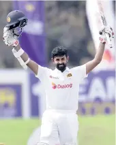  ??  ?? Lahiru Thirimanna of Sri Lanka celebrates his century during the first test match against England in Galle on Sunday