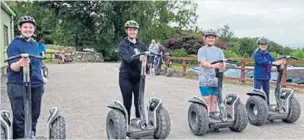  ??  ?? Mary-jane’s family and a friend go for a spin on Segways.