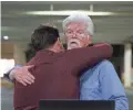  ?? AP ?? Capital Gazette reporters hug at a makeshift office Thursday during coverage of the fatal shootings.