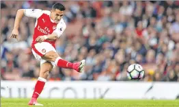  ??  ?? Arsenal's Chilean striker Alexis Sanchez takes a shot at goal during the EPL match against Sunderland at the Emirates Stadium in London.