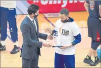  ?? JOSE CARLOS FAJARDO — BAY AREA NEWS GROUP FILE ?? Golden State Warriors general manager Bob Myers, left, gives Stephen Curry an award before the start of their game at Chase Center in San Francisco on May 14.