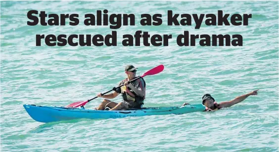  ?? Photo / Paul Taylor ?? Rescued man Hamish Barclay and his stricken kayak arrive back on dry land at Clifton Reserve after the rescue.